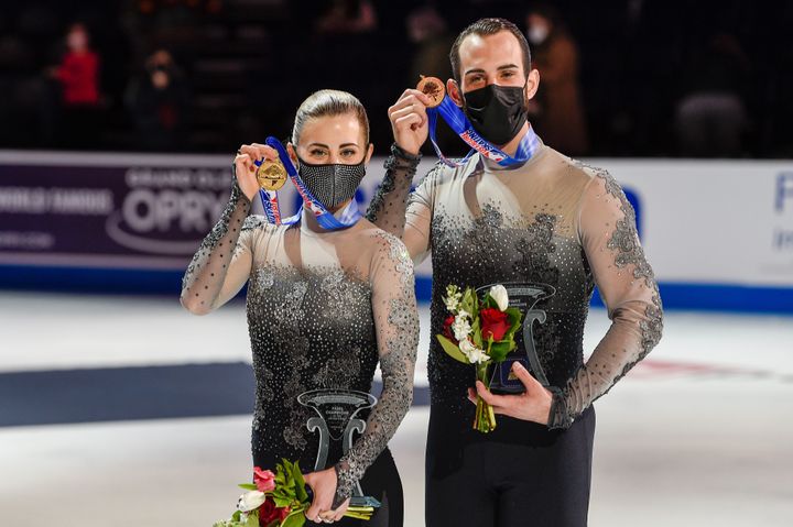 Timothy LeDuc and Ashley Cain-Gribble show off their gold medals at the U.S. Figure Skating Championships.