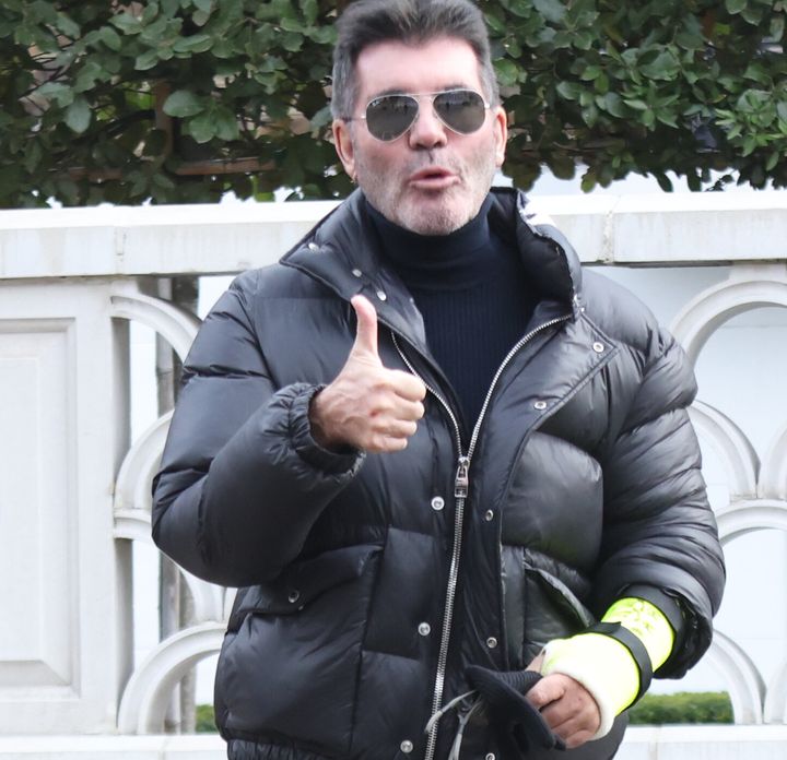 Simon Cowell outside his home in west London after his bike accident