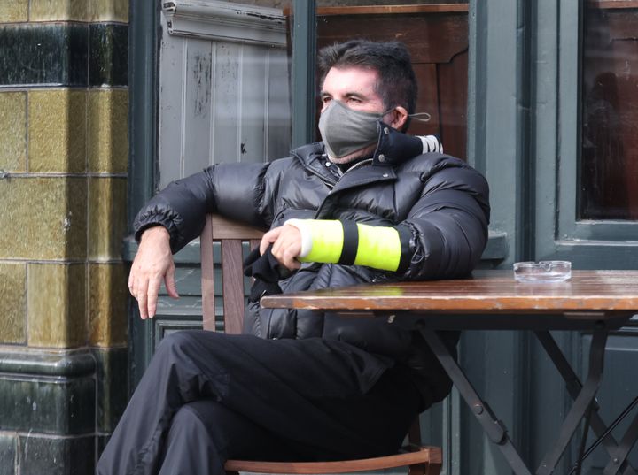 Simon was also seen with his cast outside a local pub