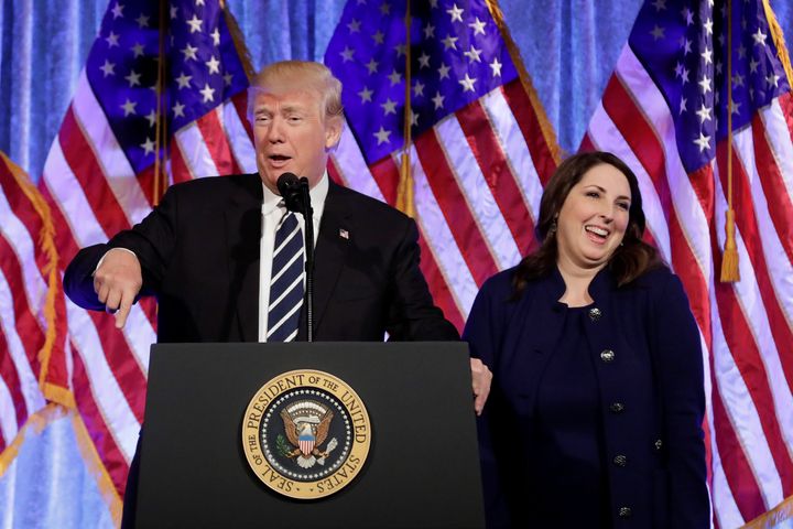 RNC chairwoman Ronna McDaniel reacts next to then-President Donald Trump at a fundraising event in New York on Dec. 2, 2017.