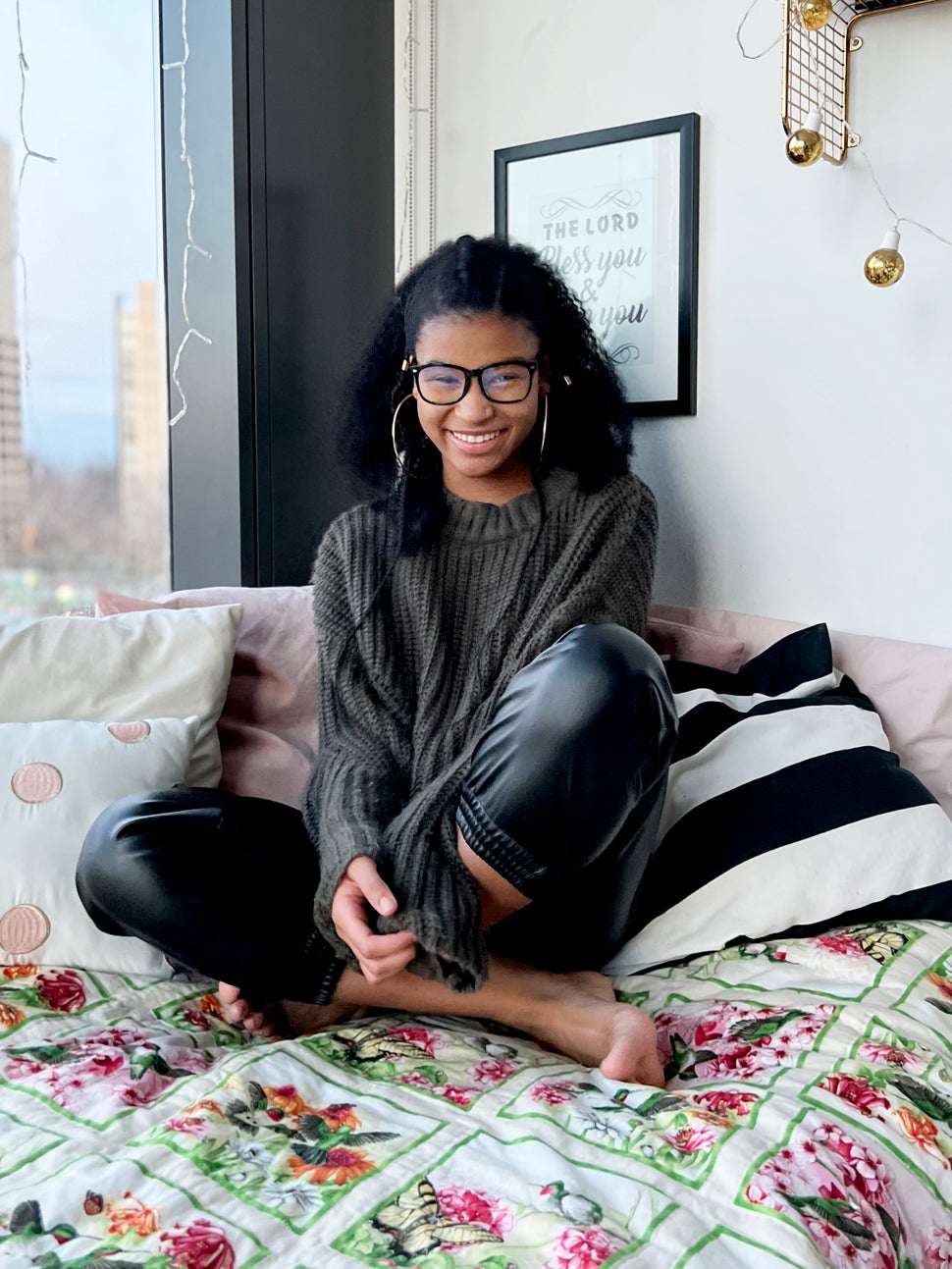 Eden Wilson in her bedroom with a quilt made by her grandmother Callie Wilson.