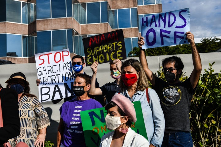 People protest against Florida's 15-week abortion ban in front of the office of State Sen. Ileana Garcia, a strong supporter of the ban, in Coral Gables, Florida, on Jan. 21.