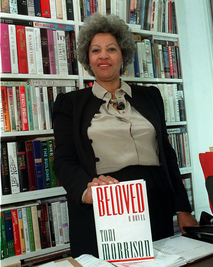 Toni Morrison, who died in 2019, is seen posing with a copy of her book "Beloved" in New York, September 1987.