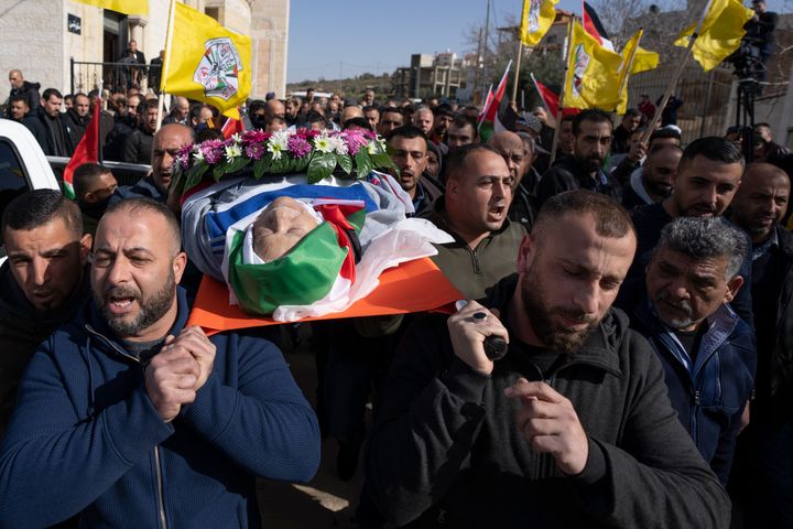 Mourners carry the body of Omar Assad during his funeral in the West Bank village of Jiljiliya, north of Ramallah, on Jan. 13. Two members of Wisconsin's congressional delegation asked the Biden administration to investigate how a Palestinian American who lived in Milwaukee before moving back to his home village died at a West Bank checkpoint. 