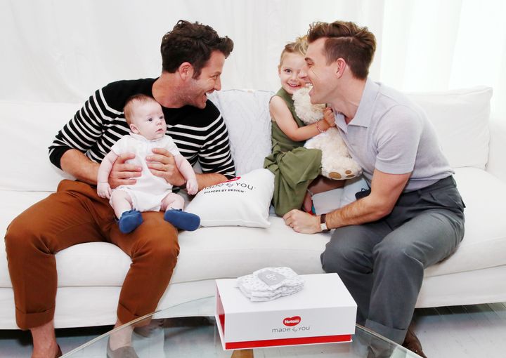 Nate Berkus (left) and Jeremiah Brent pose with their son, Oskar, and daughter, Poppy, in 2018.