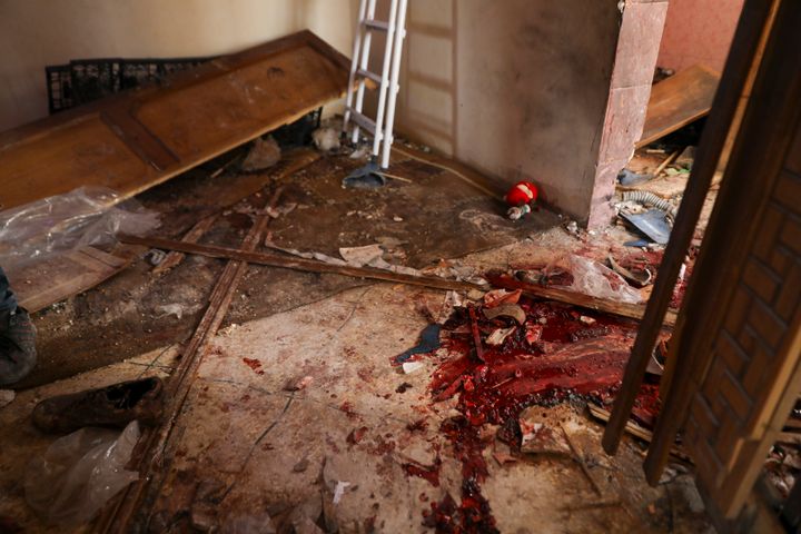 Blood covers the floor of a destroyed house after an operation by the U.S. military in the Syrian village of Atmeh in Idlib province, Syria on Thursday.