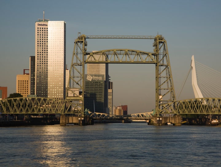 Early morning sunshine lights up the River Maas and Koningshaven Bridge in Rotterdam, Netherlands, in this undated file photo.