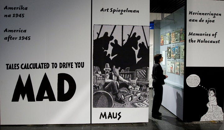 A museum worker is seen preparing an exhibition at the Jewish Historical Museum in Amsterdam in 2008. The exhibition, entitled "Superheros and Shlemiels," included Pulitzer Prize-winning graphic novel "Maus" and comic strips that have overt or subtle Jewish themes.