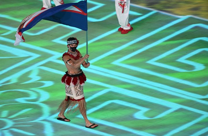 Nathan Crumpton carries the flag for American Samoa into Beijng's National Stadium during Friday's opening ceremony. 