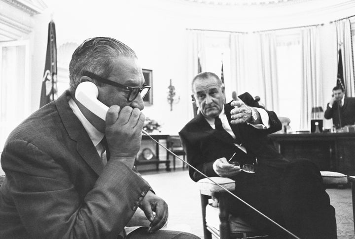 Thurgood Marshall, the first Black Supreme Court Justice, calls his wife on the Oval Office telephone to let her know of his nomination as President Lyndon B. Johnson looks on.