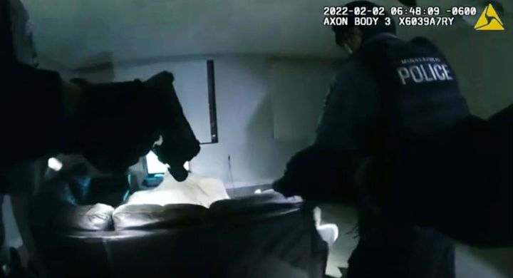 In this image taken from Minneapolis Police Department body camera video and released by the city of Minneapolis, Minneapolis police enter an apartment on Wednesday, Feb. 2, 2022, moments before shooting 22-year-old Amir Locke.