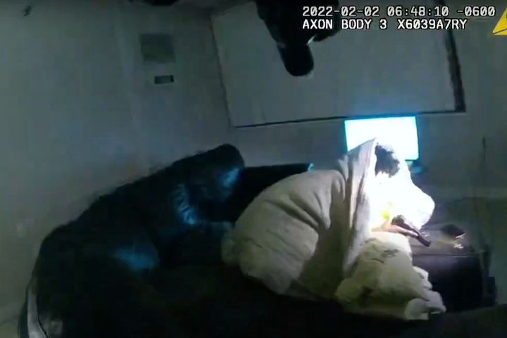 In this image taken from body camera video and released by the city of Minneapolis, Amir Locke holds a gun moments before police officers fatally shoot him while executing a no-knock search warrant on Wednesday.