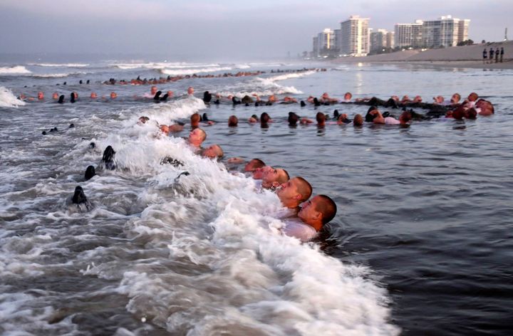 SEAL candidates are seen participating in "surf immersion" during Basic Underwater Demolition/SEAL training at the Naval Special Warfare (NSW) Center in Coronado, Calif., in 2020.