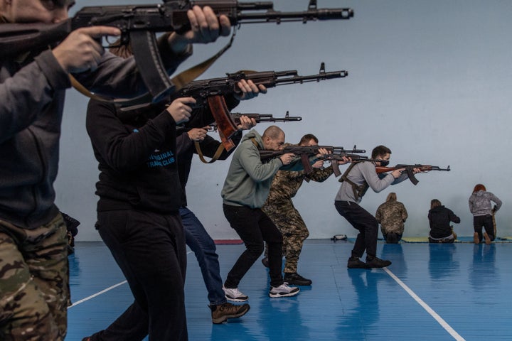 Civilians participate in a beginners combat and survival training course run by instructors from the Ukraine Territorial Defence units at a school in Kyiv, Ukraine on February 6. Across Ukraine thousands of civilians are participating in such groups to receive basic combat, medical and survival training.