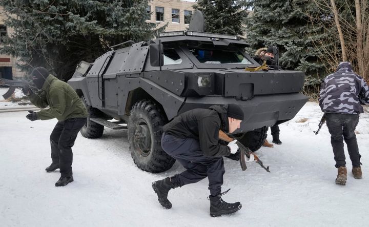 Local residents attend an all-Ukrainian training campaign "Don't panic! Get ready!" close to Kyiv, Ukraine, on Sunday. While Ukrainian officials have acknowledged the country has little chance to fend off a full Russian invasion, Russian occupation troops would likely face a deep-rooted, decentralized and prolonged insurgency. 