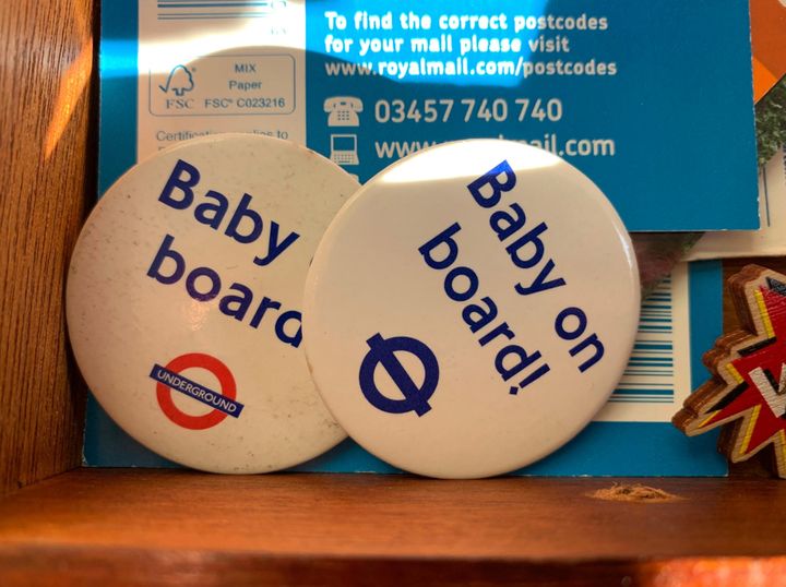 Badges often worn by pregnant people while riding public transportation in London.