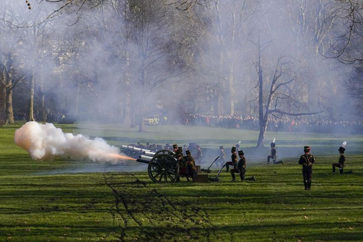 Fire shrouds the scene as The King's Troop Royal Horse Artillery fire gun salutes to mark the 70th anniversary of the accession to the throne of Queen Elizabeth, in Green Park beside Buckingham Palace on Feb. 7. 
