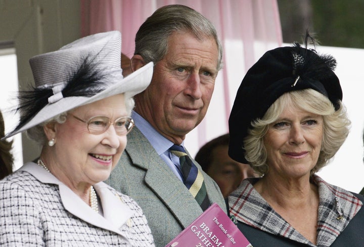 Prince Charles and Camilla, Duchess of Cornwall, with Queen Elizabeth II attend the Braemar Games Highland gathering on Sept. 2, 2006, in Scotland.