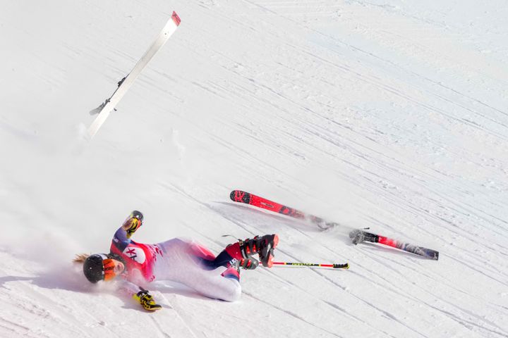 Nina O'Brien falls during the women's giant slalom at the 2022 Winter Olympics on Monday.