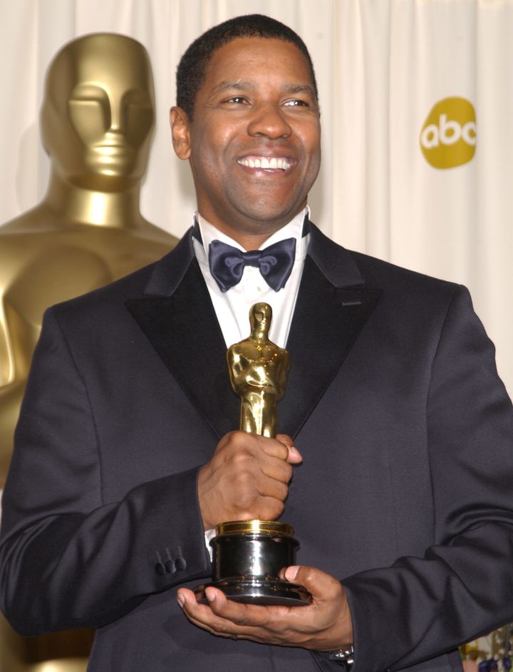 Denzel Washington holds his Oscar for Best Actor for "Training Day" in the press room at the 74th annual Academy Awards in 2002.