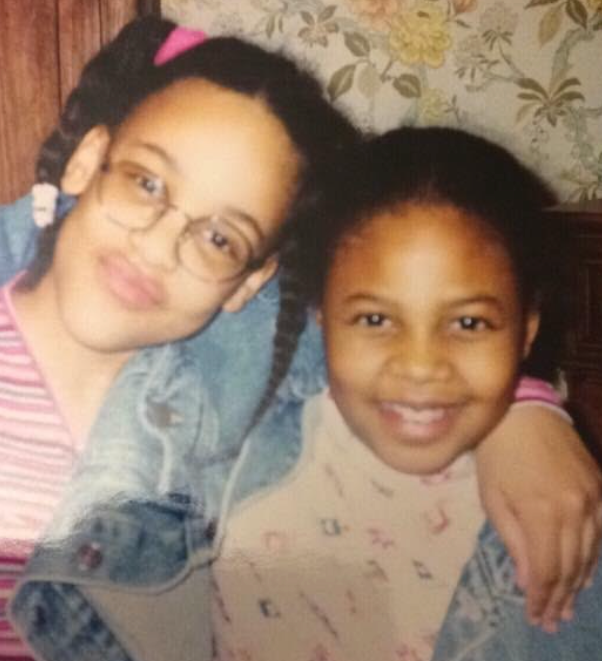 The author (left), at age 12, posing with a childhood friend.