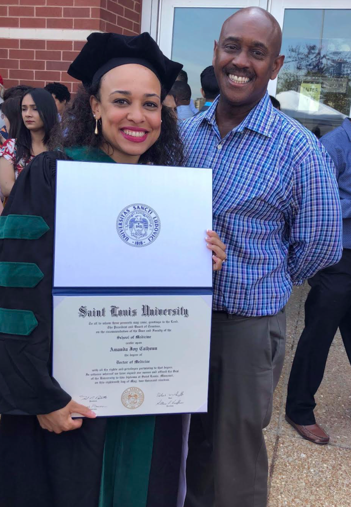 The author with her father at her medical school graduation.