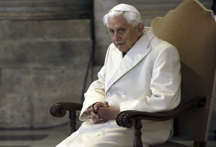 This Dec. 8, 2015 file photo shows Pope Emeritus Benedict XVI sitting in St. Peter's Basilica as he attends the ceremony marking the start of the Holy Year. 