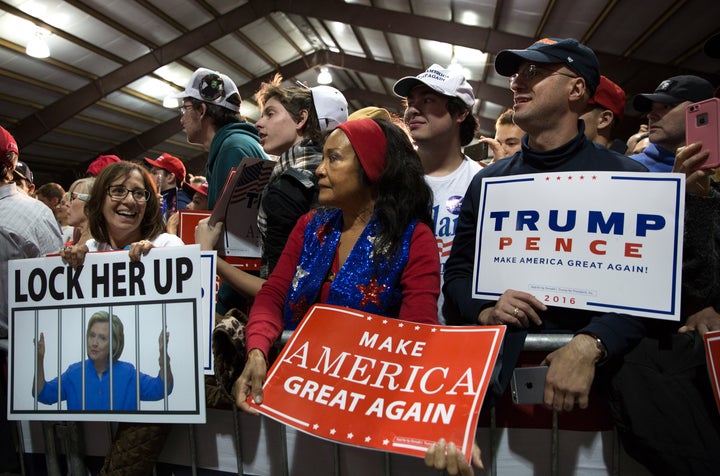 View of supporters with signs as they attend Donald Trump's campaign rally at the Loudoun Fairgrounds in Leesburg, Virginia, Nov. 7, 2016.