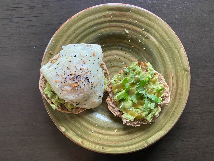 Avocado toast topped with an egg and everything bagel seasoning.