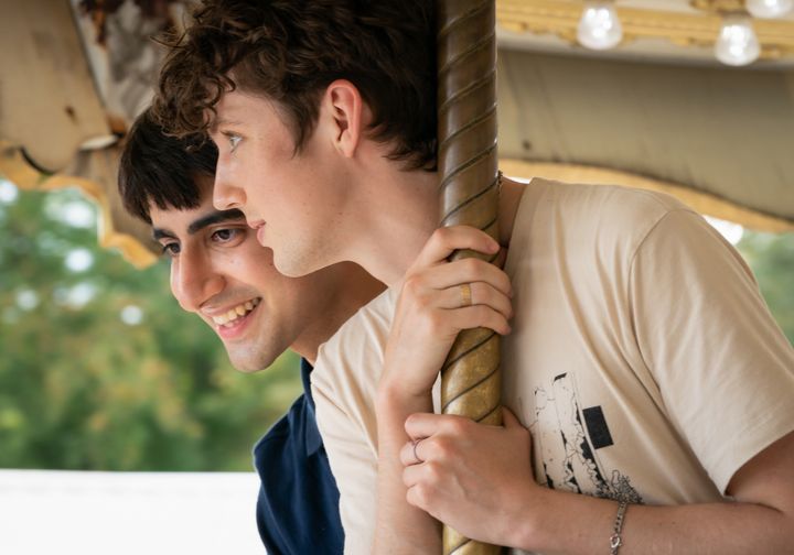 Viveik Kalra (left) and Troye Sivan fall in love — or do they? — on a merry-go-round in "Three Months," out now on Paramount+.