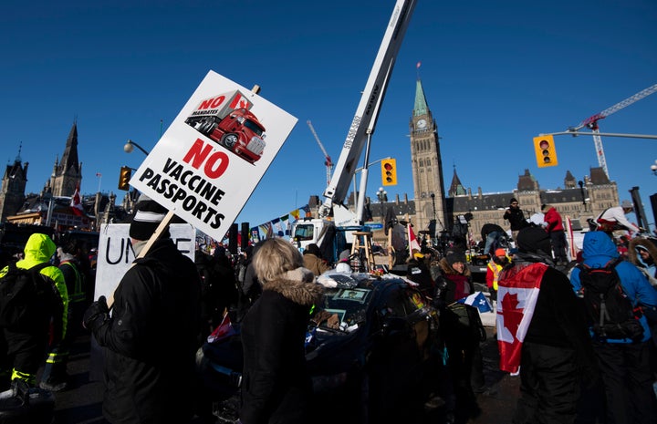 COVID-19 Vaccine Mandate Protests Threaten Border Trade
Between U.S., Canada 1 People hold signs and wave flags at an Ottawa protest against COVID-19 restrictions.