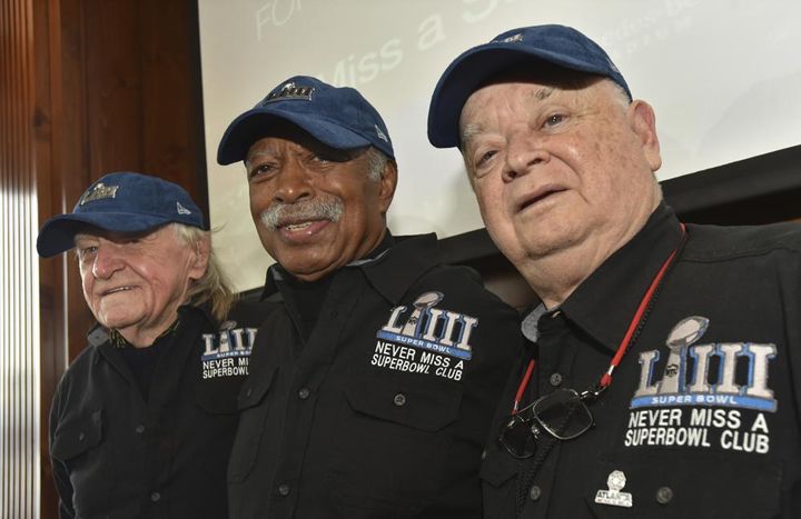 Members of the Never Miss a Super Bowl Club, from the left, Tom Henschel, Gregory Eaton, and Don Crisman pose for a group photograph during a welcome luncheon, in Atlanta, Friday, Feb. 1, 2019. 