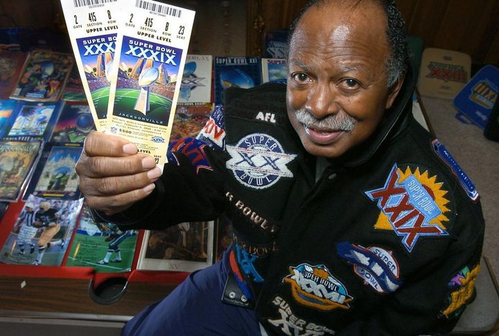 Gregory Eaton shows his tickets for the 2005 Super Bowl while seated among many other Super Bowl programs and souvenirs on Jan. 31, 2005, in Lansing, Michigan.