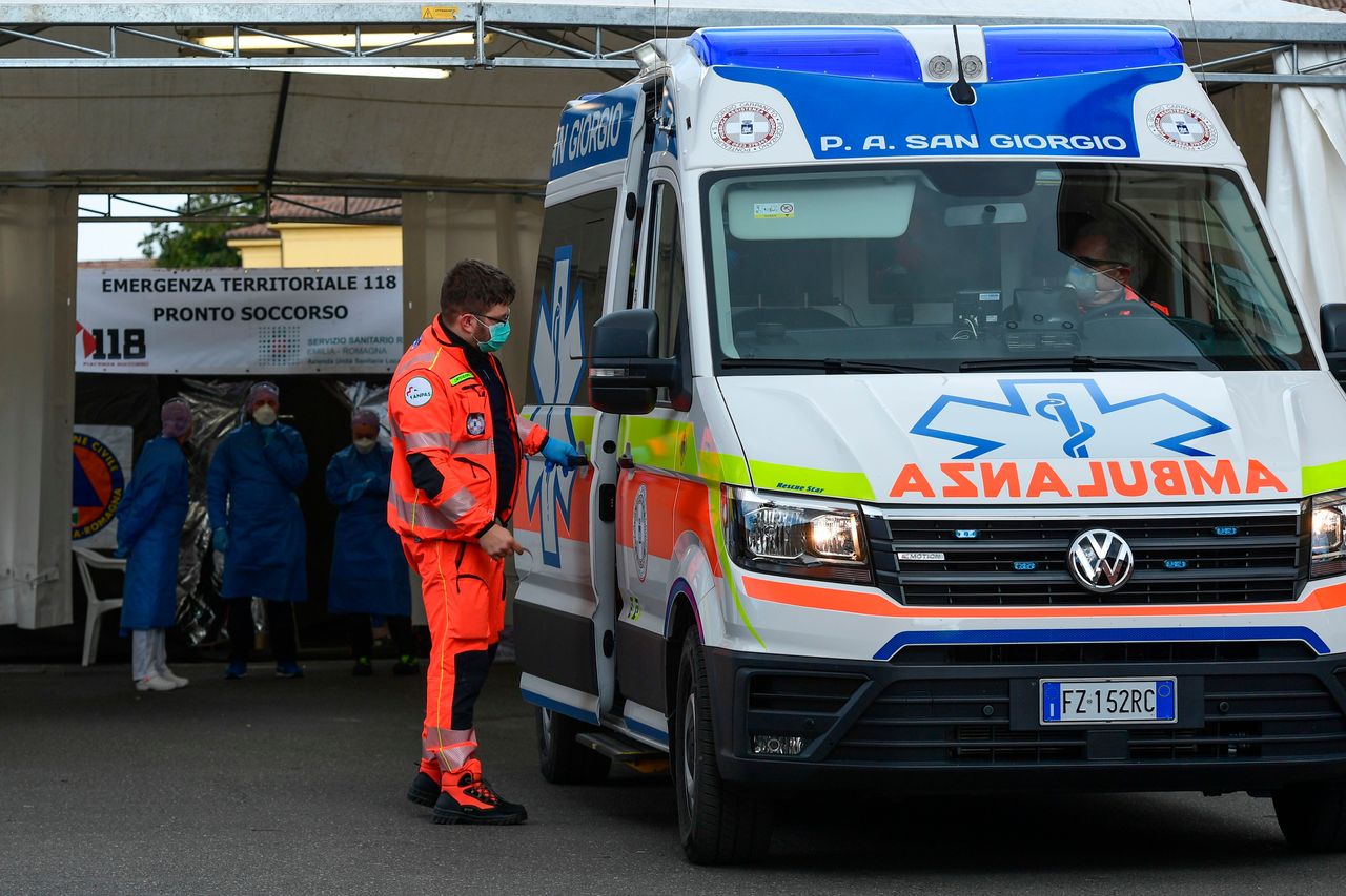An ambulance is parked outside a sanitary tent installed in Piacenza outside the hospital on Feb. 26, 2020.