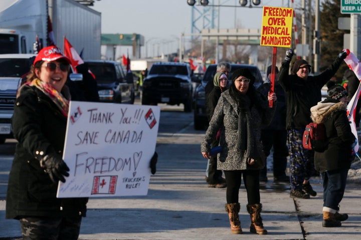 Vehicles block the route leading from the Ambassador Bridge, linking Detroit and Windsor, as truckers and their supporters continue to protest against the coronavirus disease (COVID-19) vaccine mandates, in Windsor, Ontario, Canada February 8, 2022. REUTERS/Carlos Osorio