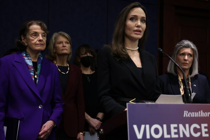 Actor Angelina Jolie speaks as Sen. Dianne Feinstein (D-Calif.), left, Sen. Lisa Murkowski (R-Alaska), National Coalition Against Domestic Violence President Ruth Glenn and Sen. Joni Ernst (R-Iowa) show support at a Wednesday news conference at the U.S. Capitol. A bipartisan group of senators announced modernized legislation on the Violence Against Women Act.