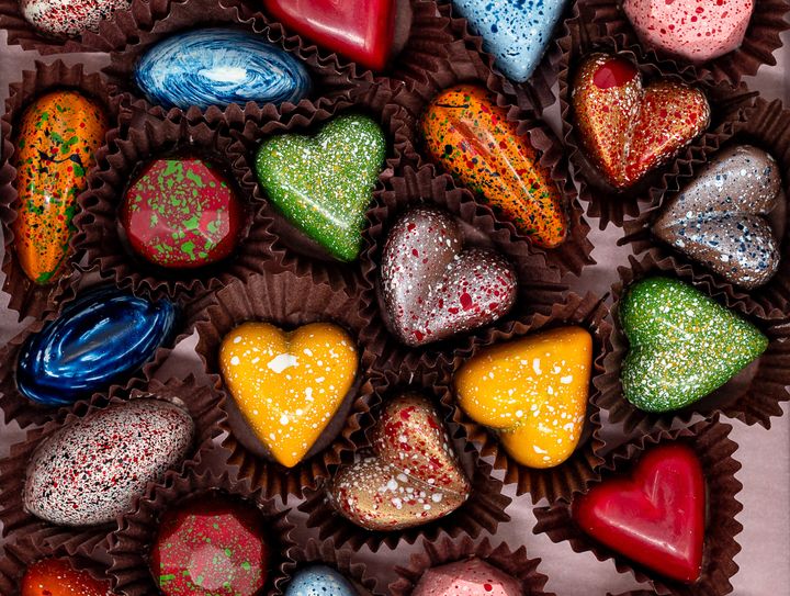 Colorful glaze covered chocolate candies. Delicious chocolate. Square format photo