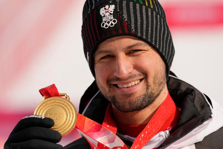 Johannes Strolz, of Austria, smiles during the medal ceremony for the men's combined at the 2022 Winter Olympics.