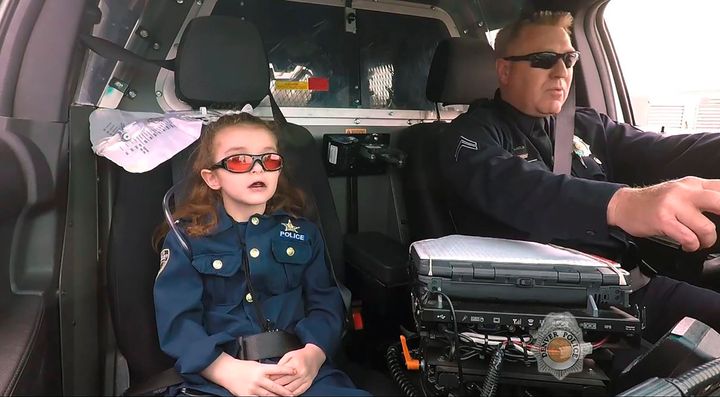 Olivia Gant is seen in 2017 riding with a Denver police captain during a call. Olivia's mother, Kelly Turner, was sentenced Wednesday to 16 years in prison for child abuse resulting in death, charitable fraud and theft between $100,000 and $1 million.