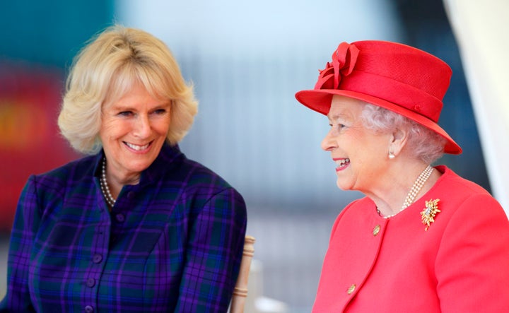 Camilla, Duchess of Cornwall, and Queen Elizabeth II watch a riding display on Oct. 29, 2013, in London.