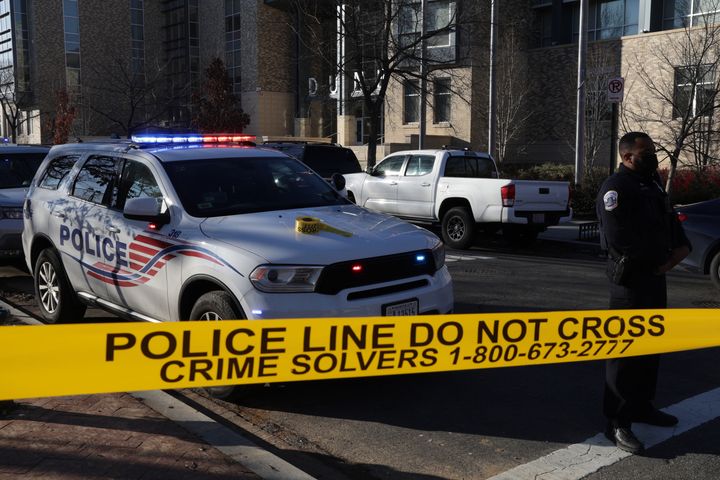 The Metropolitan Police Department guards an entrance amid an investigation into threats made against Dunbar High School on Tuesday.