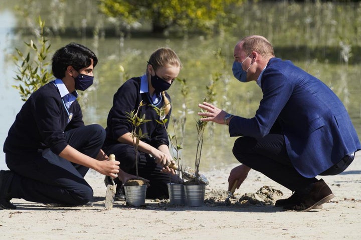 William talks to British School Al-Khubairat students Amaan Haider, 13, left, and Lilly-Rose Mayall, 12, at the Al-Jubail Mangrove Park in Abu Dhabi on Feb. 10.