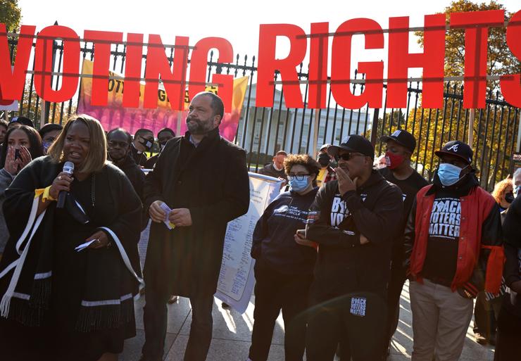 People for the American Way President Ben Jealous (third from left) and Black Voters Matter Executive Director Cliff Albright (fifth from left) join a voting rights protest Nov. 17 in front of the White House. 