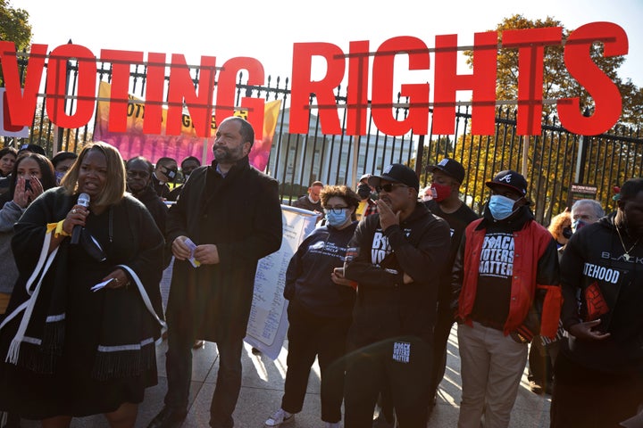 People for the American Way President Ben Jealous (third from left) and Black Voters Matter Executive Director Cliff Albright (fifth from left) join a voting rights protest Nov. 17 in front of the White House.