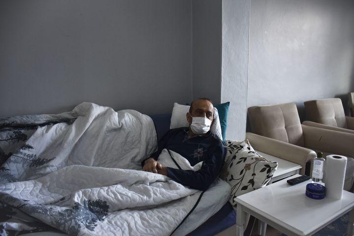 ISTANBUL, TURKIYE - FEBRUARY 05: Muzaffer Kayasan, who was treated for leukemia, lies on a couch in his house in Istanbul, Turkiye on February 05, 2022. All Covid-19 tests of Muzaffer Kayasan since 19 December 2020 have been positive. (Photo by Arife Karakum/Anadolu Agency via Getty Images)