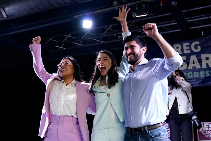 Rep. Alexandria Ocasio-Cortez (D-N.Y.), center, joins a rally for Democratic congressional candidates Jessica Cisneros, left, and Greg Casar, right, on Saturday in San Antonio.
