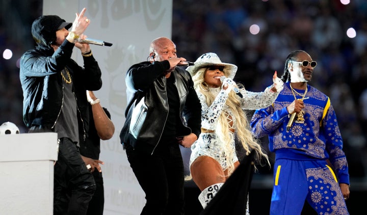 Eminem, left, along with Dr Dre, Mary J. Blige and Snoop Dogg performs during the halftime show of the Super Bowl LVI.