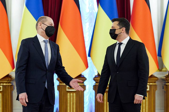 In this handout photo provided by the Ukrainian Presidential Press Office, Ukrainian President Volodymyr Zelenskyy, right, listens to German chancellor Olaf Scholz while posing for a photo during their meeting at The Mariinskyi Palace in Kyiv, Ukraine, Monday, Feb. 14, 2022. (Ukrainian Presidential Press Office via AP)