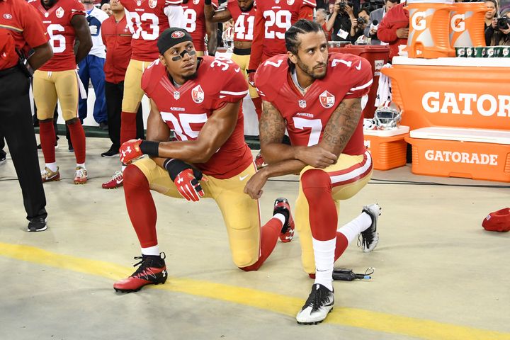 Colin Kaepernick #7 and Eric Reid #35 of the San Francisco 49ers kneel in protest during the national anthem prior to playing the Los Angeles Rams on Sept.12, 2016 in Santa Clara, California. 