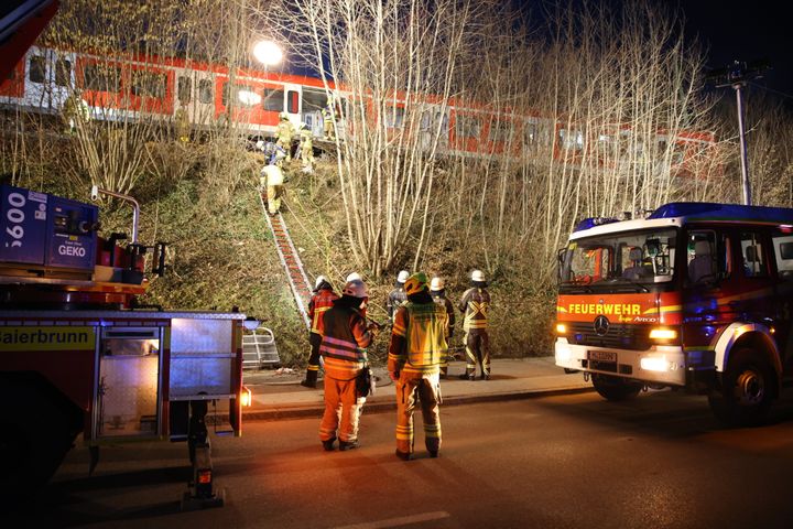 14 February 2022, Bavaria, Schäftlarn: Rescue workers work at the scene of the accident. One person was killed and more than ten injured in a collision between two commuter trains in the Munich district on Monday. There was a low double-digit number of injured, reported a spokesman for the Munich police headquarters. Photo: Matthias Balk/dpa (Photo by Matthias Balk/picture alliance via Getty Images)